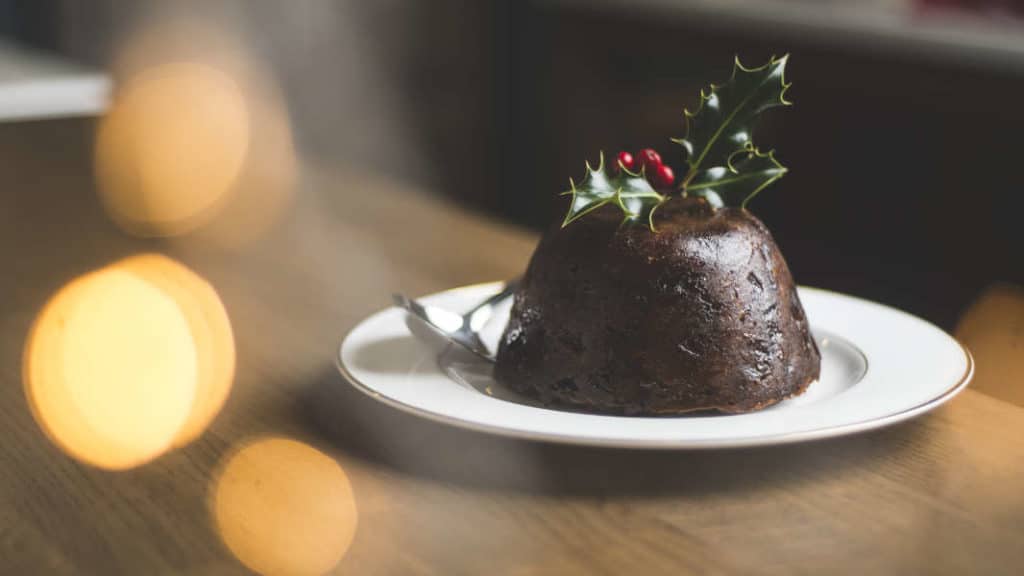 Figgy's Christmas Pudding on a plate with holly