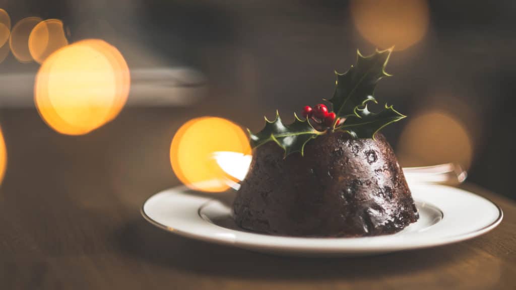 Figgy's luxury Xmas Pudding on a plate with holly